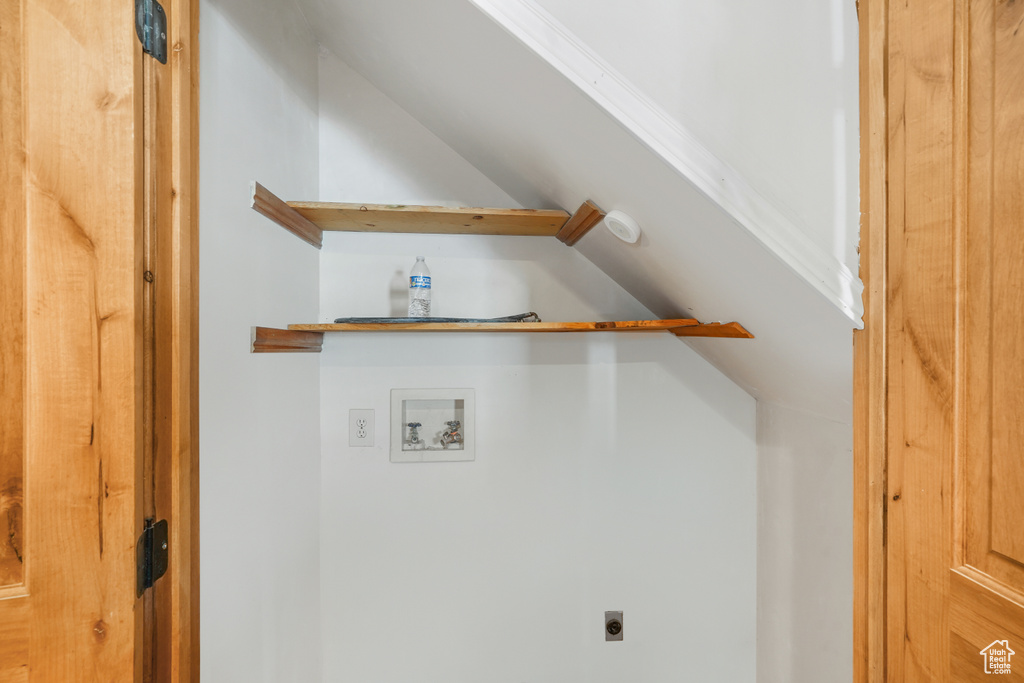 Laundry room with hookup for a washing machine and hookup for an electric dryer