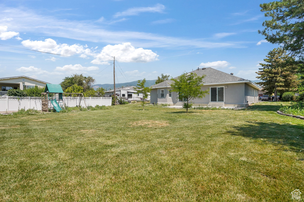 View of yard featuring a playground