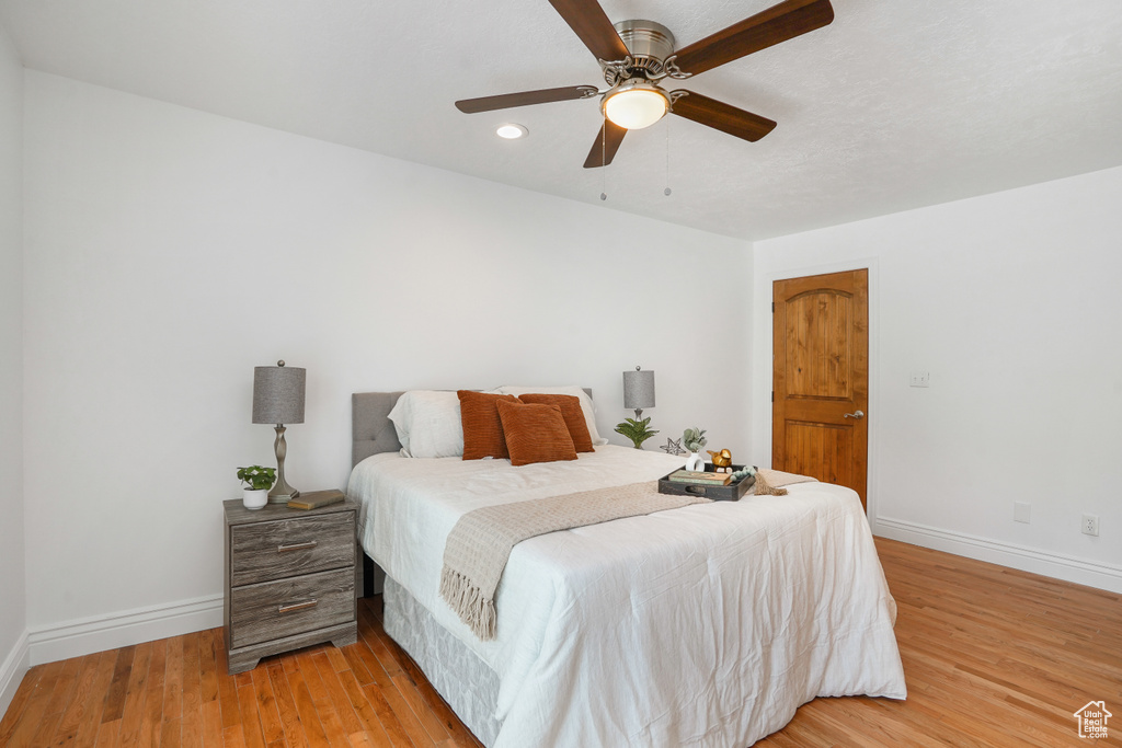 Bedroom featuring ceiling fan and light wood-type flooring