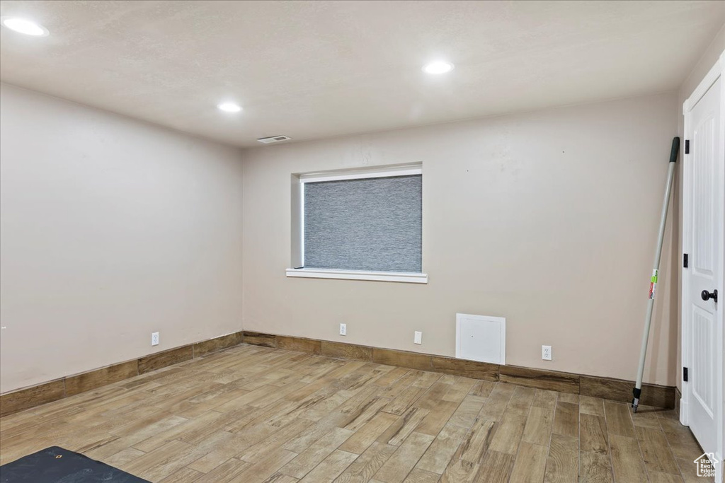 Unfurnished room with light hardwood / wood-style flooring