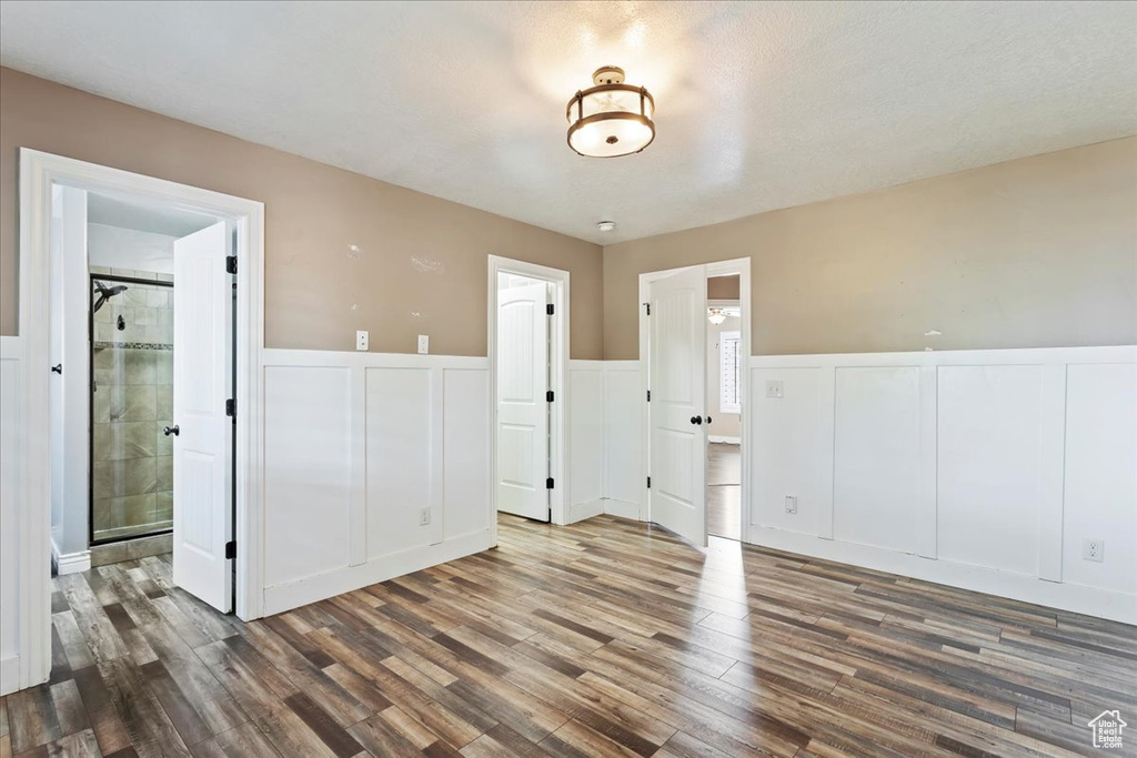 Spare room with dark hardwood / wood-style flooring