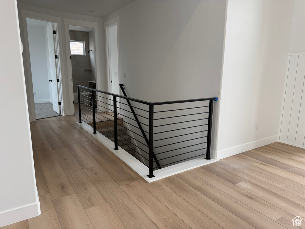 Staircase with hardwood / wood-style flooring