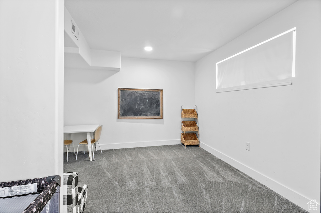 Basement featuring carpet flooring