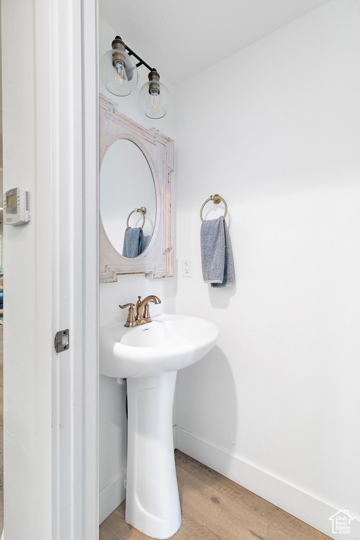 Bathroom with hardwood / wood-style flooring