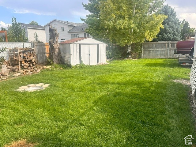 View of yard featuring a storage shed