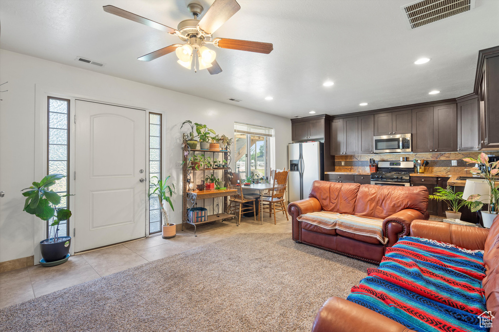 Tiled living room with ceiling fan