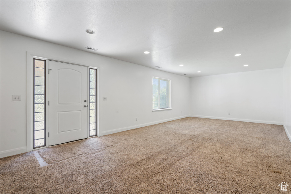 Foyer with carpet floors