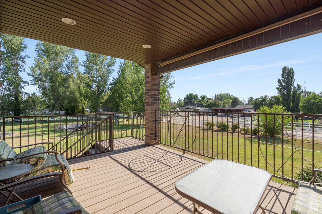 Deck featuring a yard