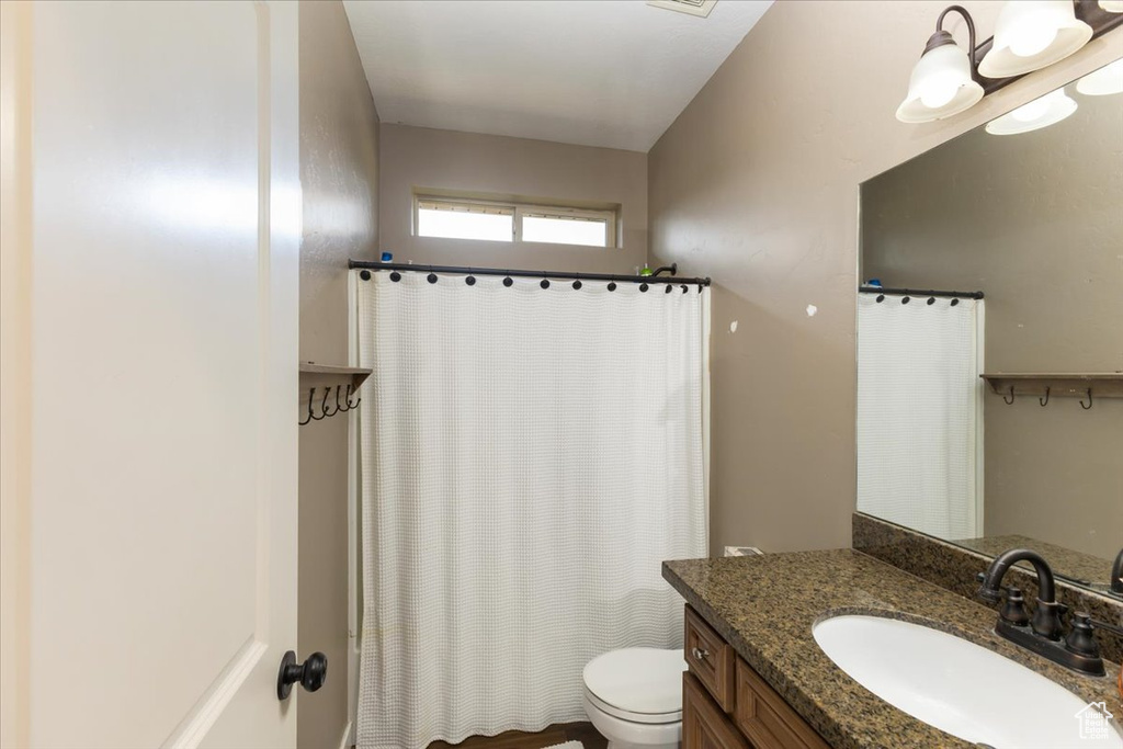 Bathroom featuring toilet and vanity