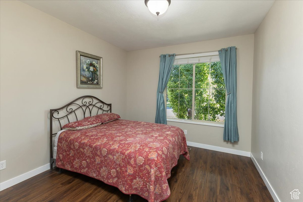 Bedroom featuring wood-type flooring