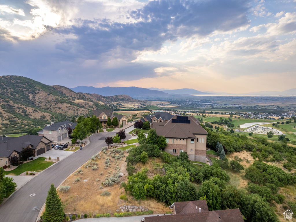 Aerial view at dusk featuring a mountain view