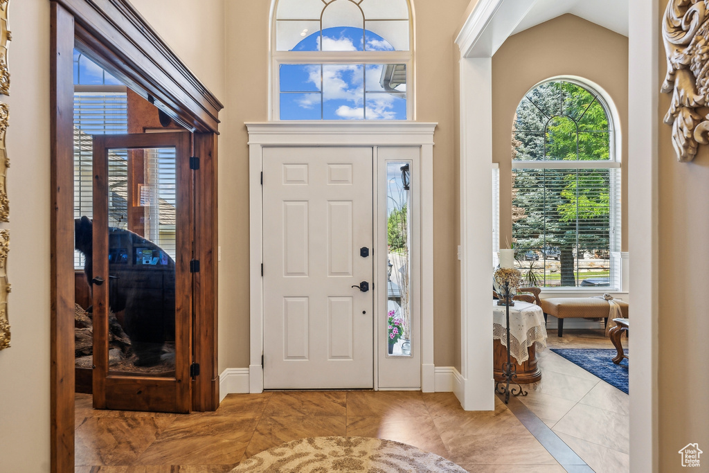 Foyer with light tile patterned floors