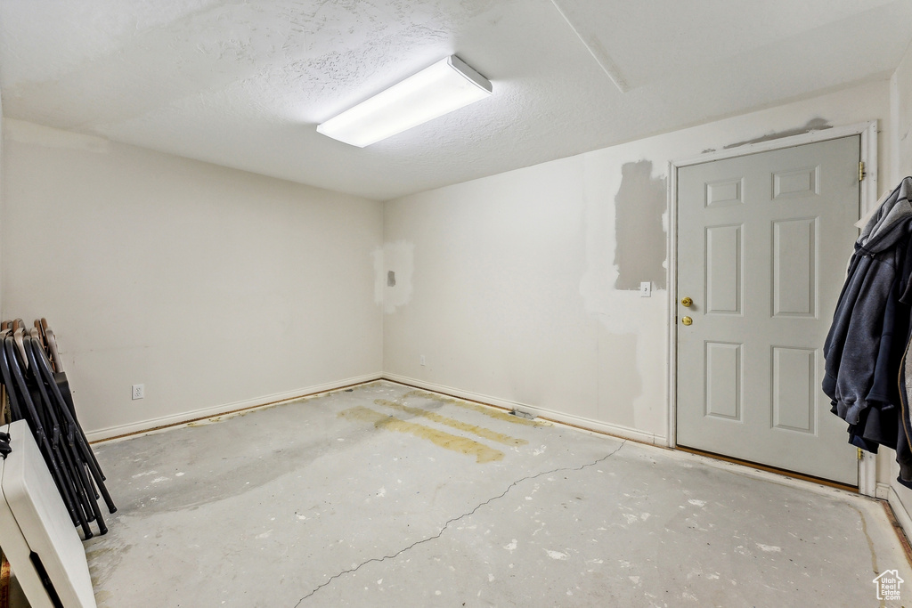 Interior space with concrete floors and a textured ceiling