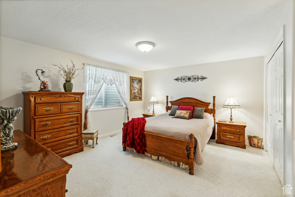 Bedroom featuring a closet and carpet floors