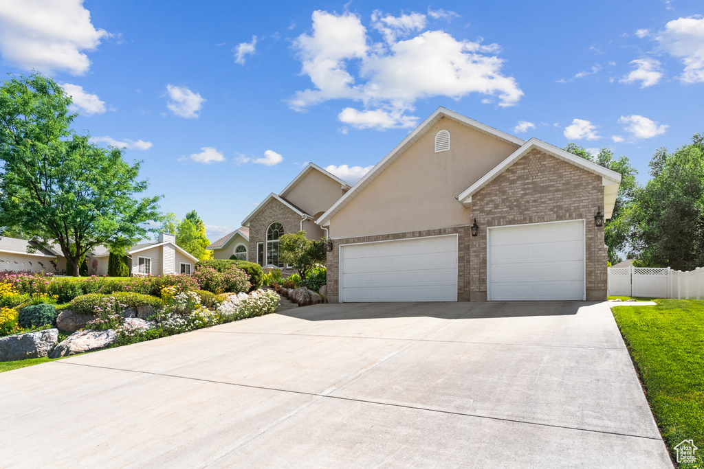 View of front of property with a garage