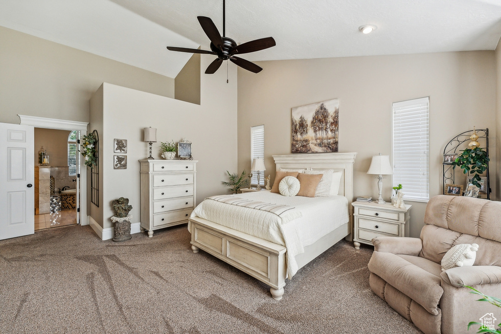 Bedroom featuring carpet, ceiling fan, and high vaulted ceiling