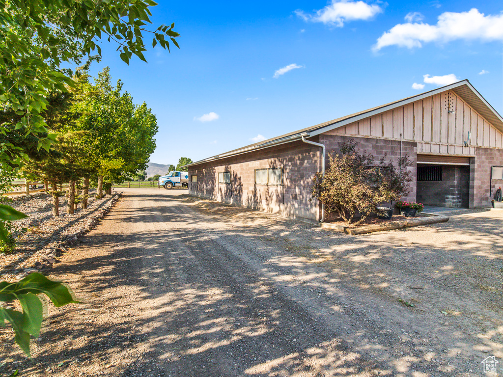 View of side of property featuring a garage