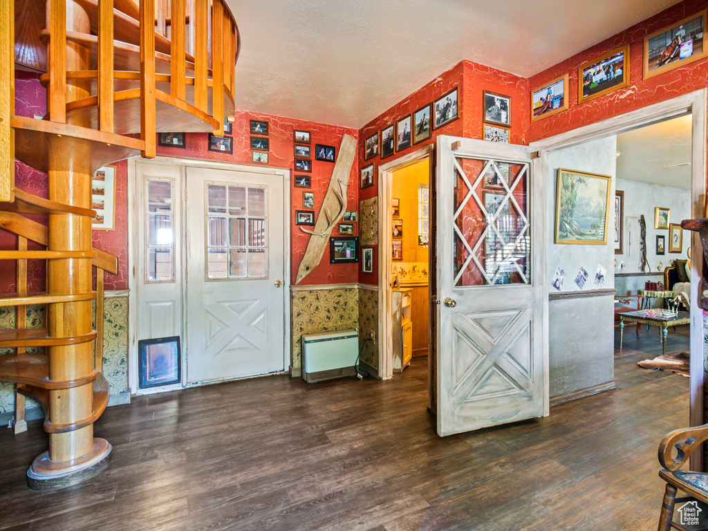 Interior space featuring dark wood-type flooring