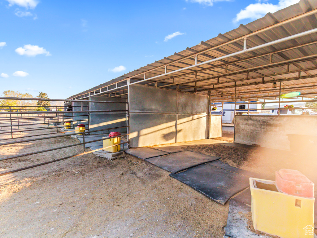 View of horse barn with an outbuilding