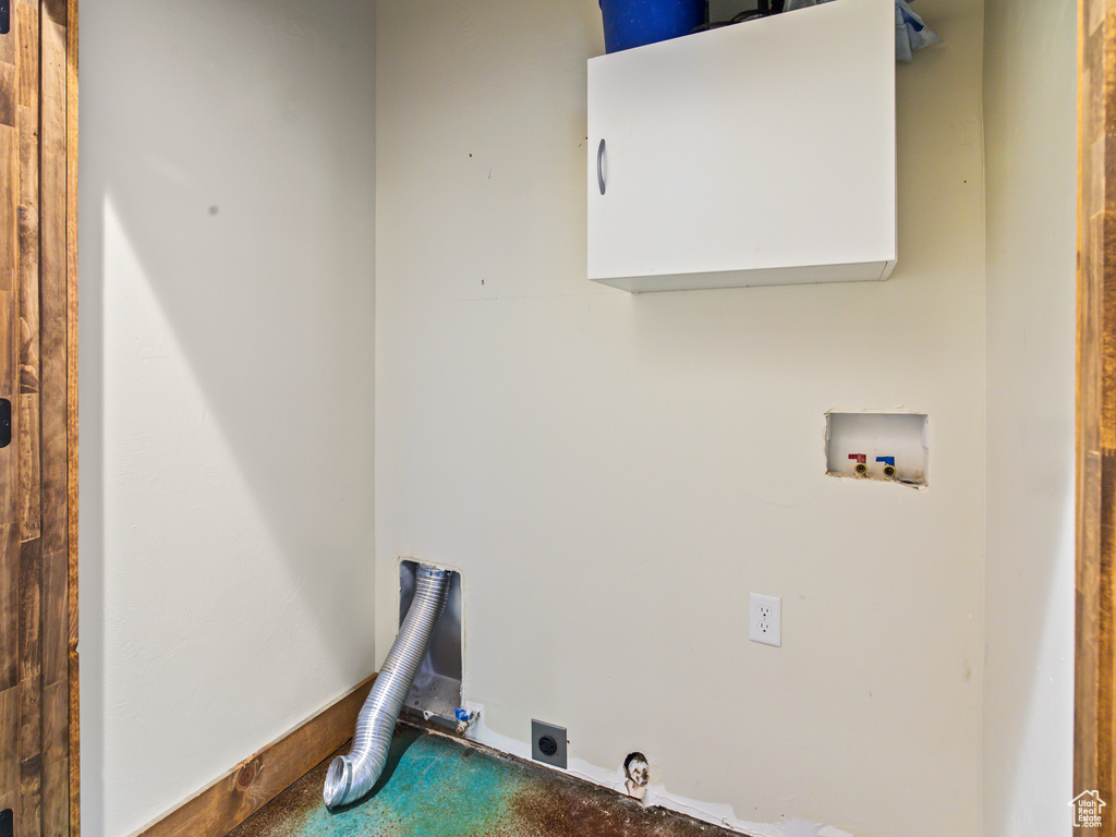 Clothes washing area with electric dryer hookup and washer hookup