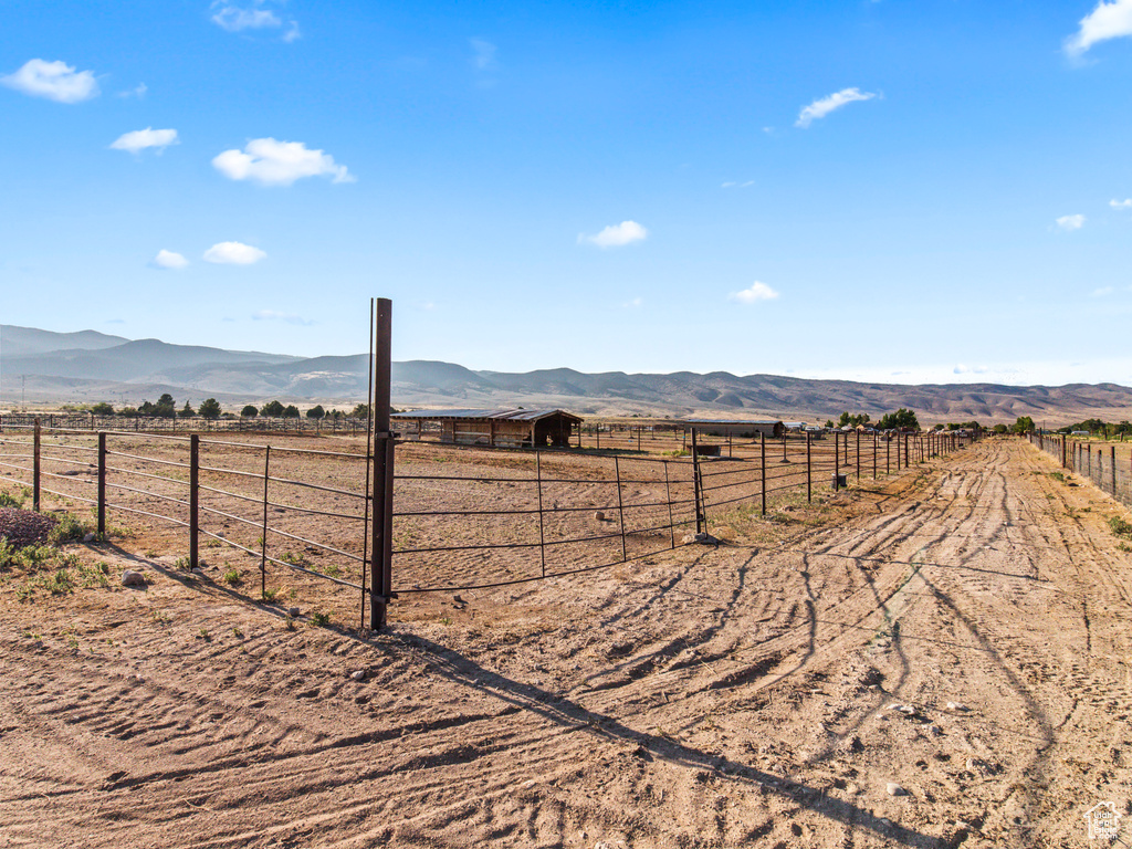 View of yard featuring a mountain view and a rural view