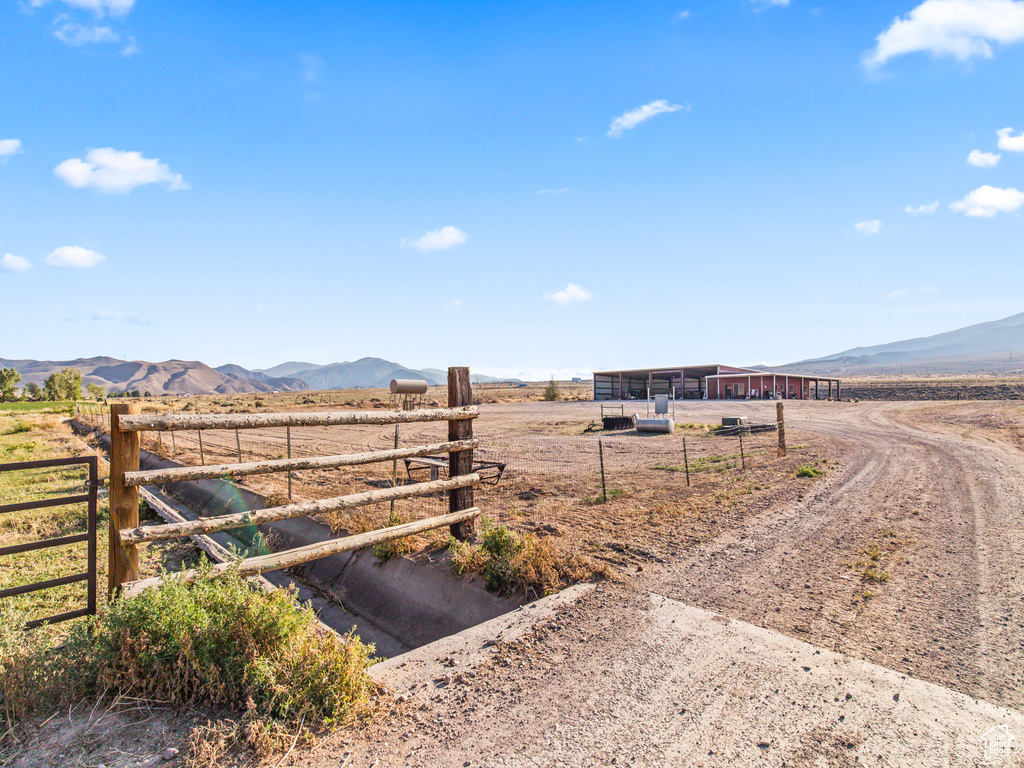 View of yard with a mountain view and a rural view