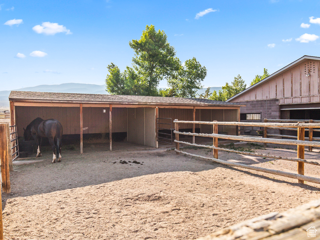 View of stable with an outdoor structure