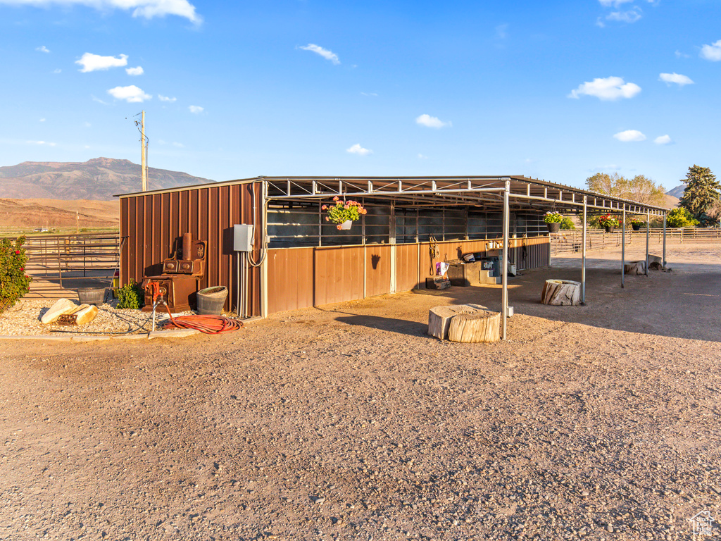 Exterior space featuring a mountain view and an outdoor structure