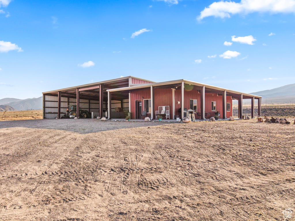 Exterior space featuring a mountain view and an outbuilding