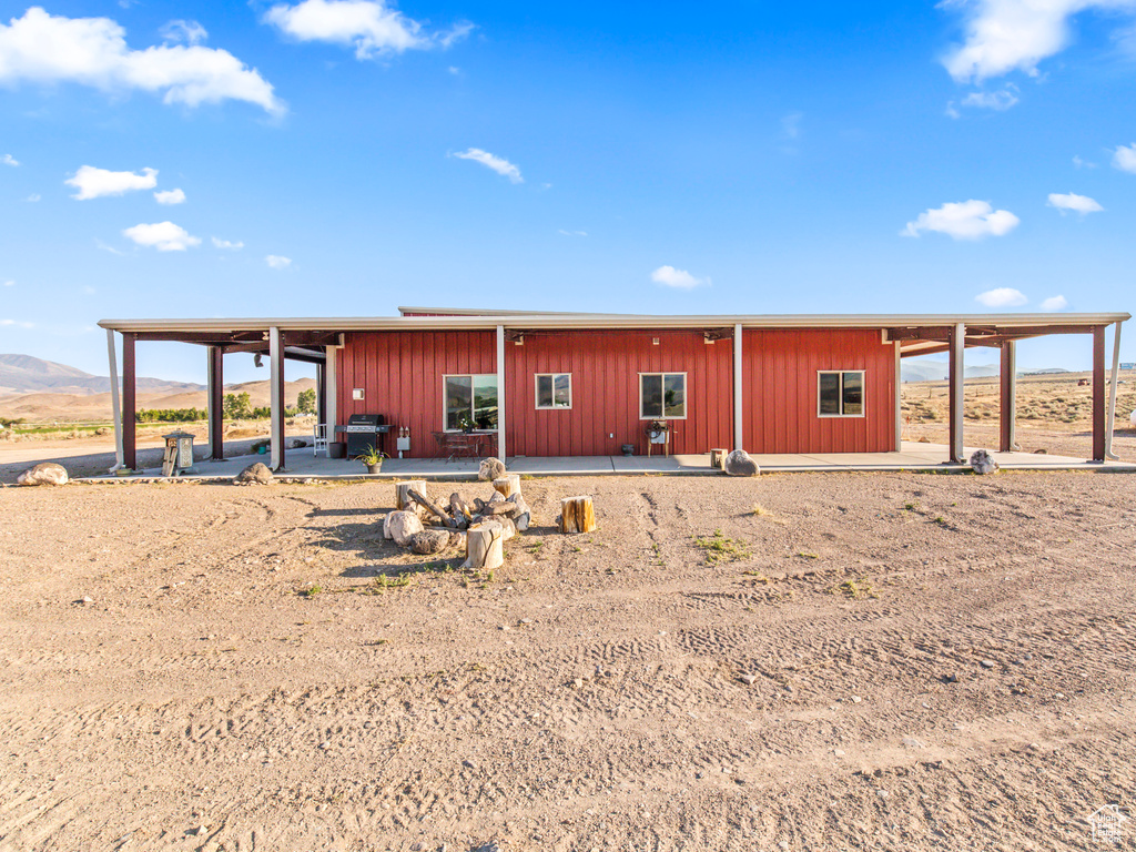 Rear view of house featuring a patio