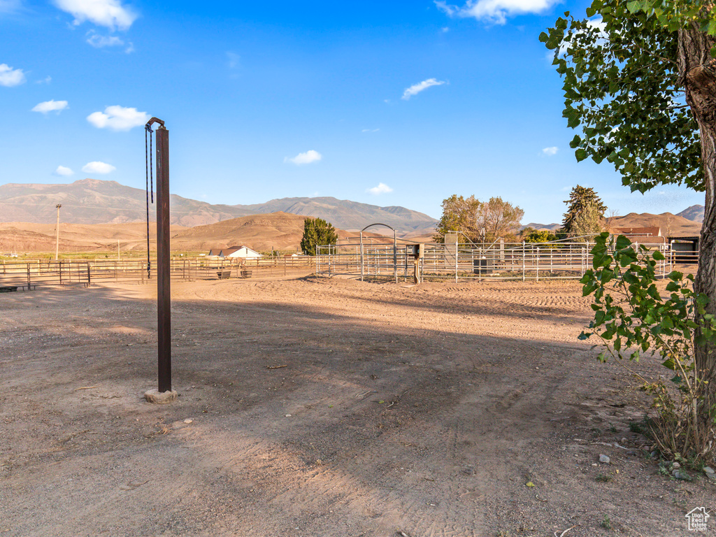 View of yard with a mountain view and a rural view