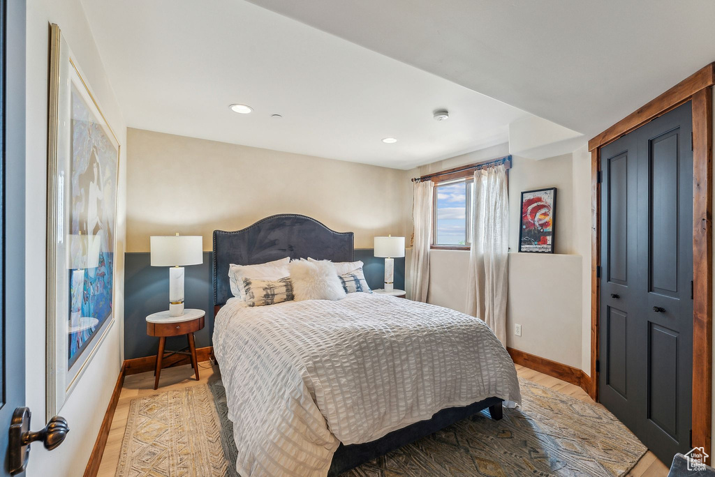 Bedroom with a closet and light wood-type flooring