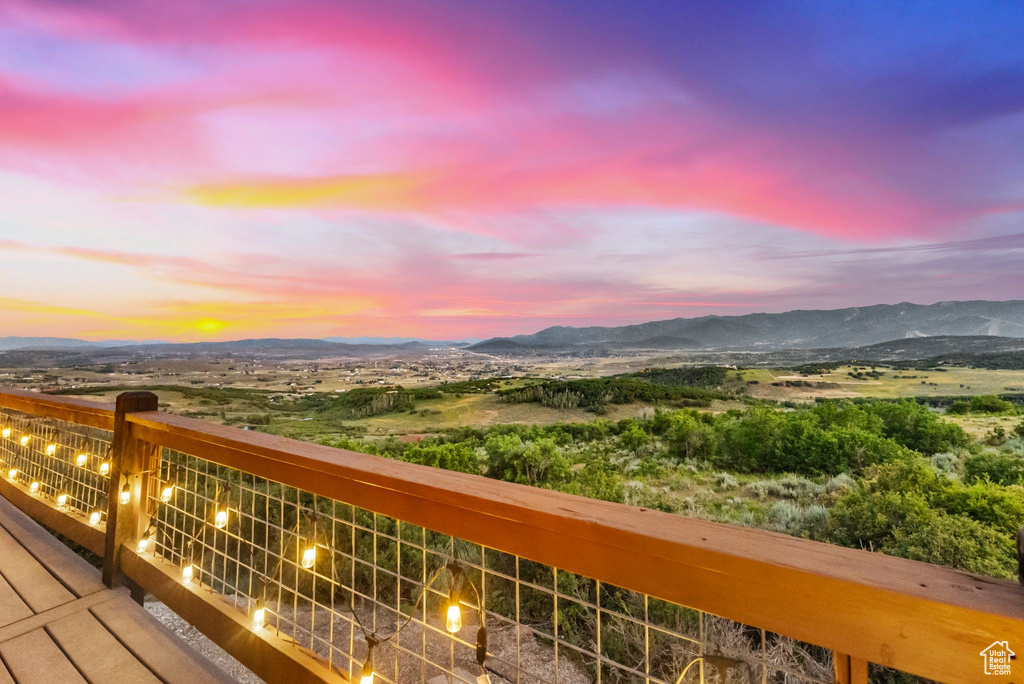 Balcony at dusk with a mountain view