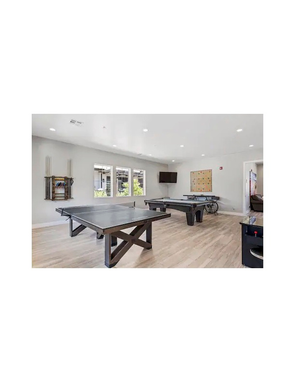 Game room featuring pool table and light hardwood / wood-style flooring