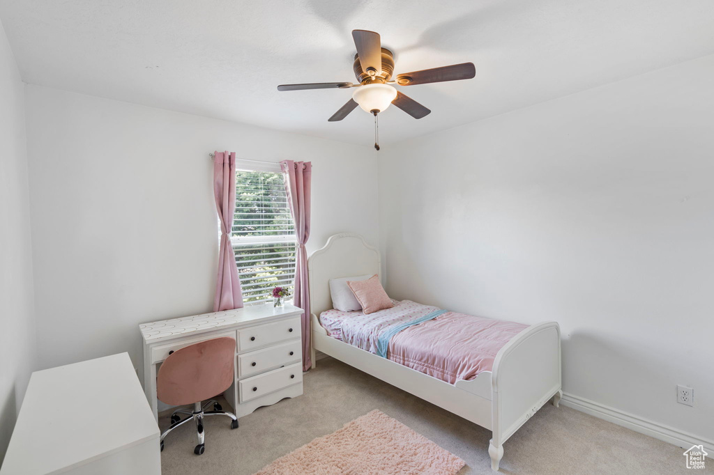 Bedroom with light carpet and ceiling fan