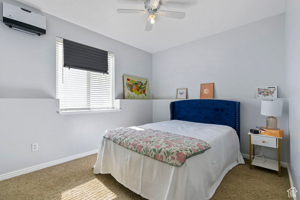 Carpeted bedroom with ceiling fan