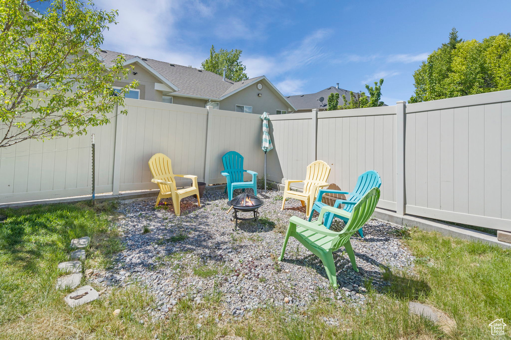 View of yard with a fire pit