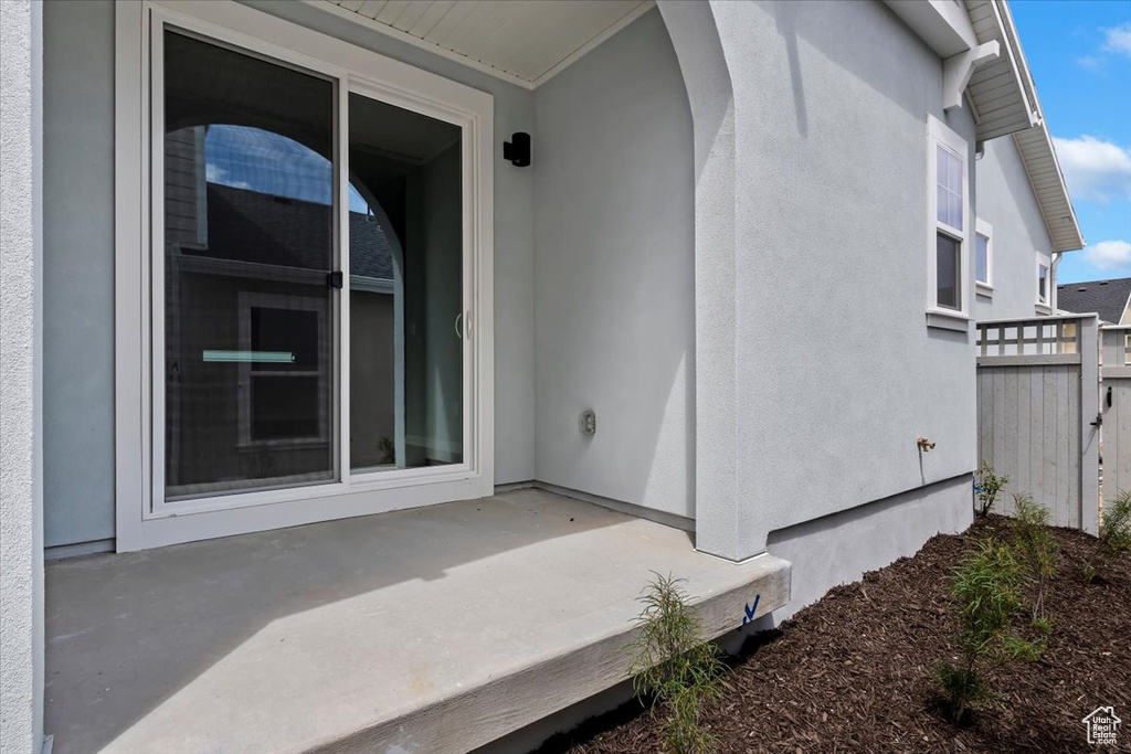 Doorway to property with a patio area