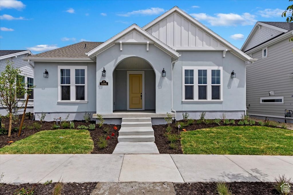 Bungalow-style home featuring a front yard