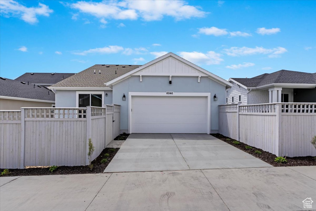 Ranch-style home with a garage