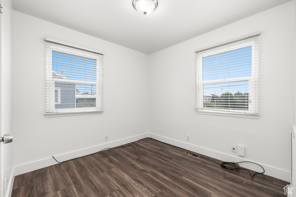 Unfurnished room featuring hardwood / wood-style flooring