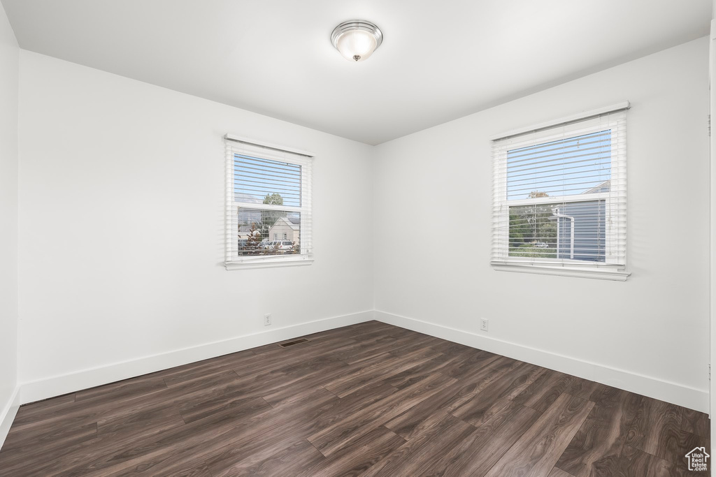 Unfurnished room featuring hardwood / wood-style floors