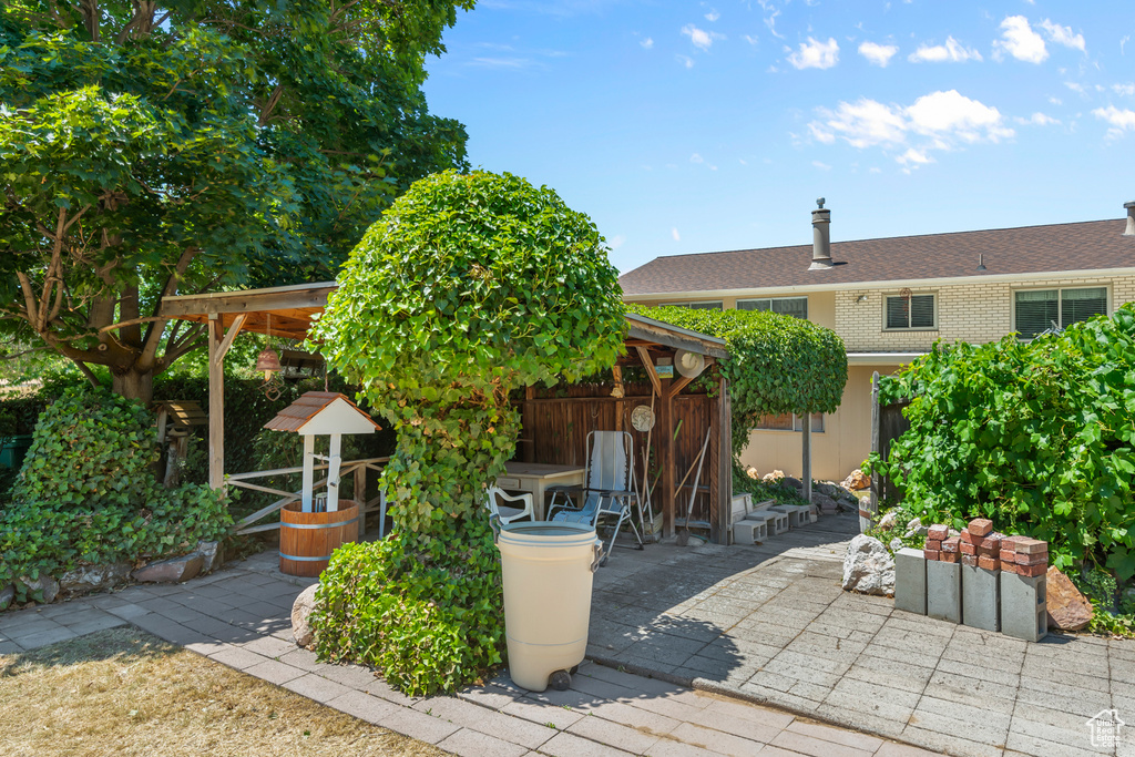 View of front of home featuring a patio