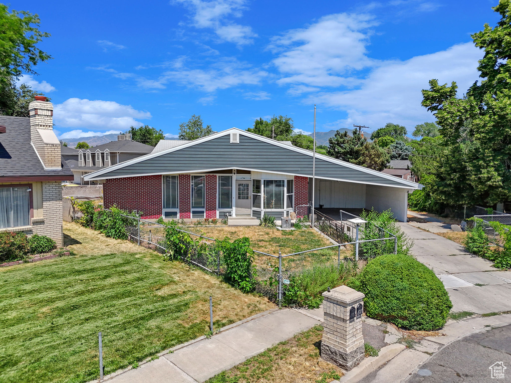 View of front of property with a front lawn