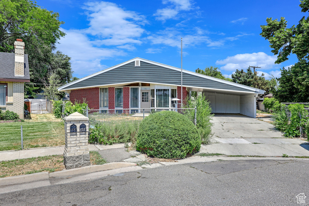 View of front facade with a carport