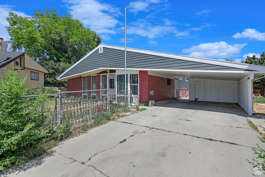 View of front facade featuring a carport