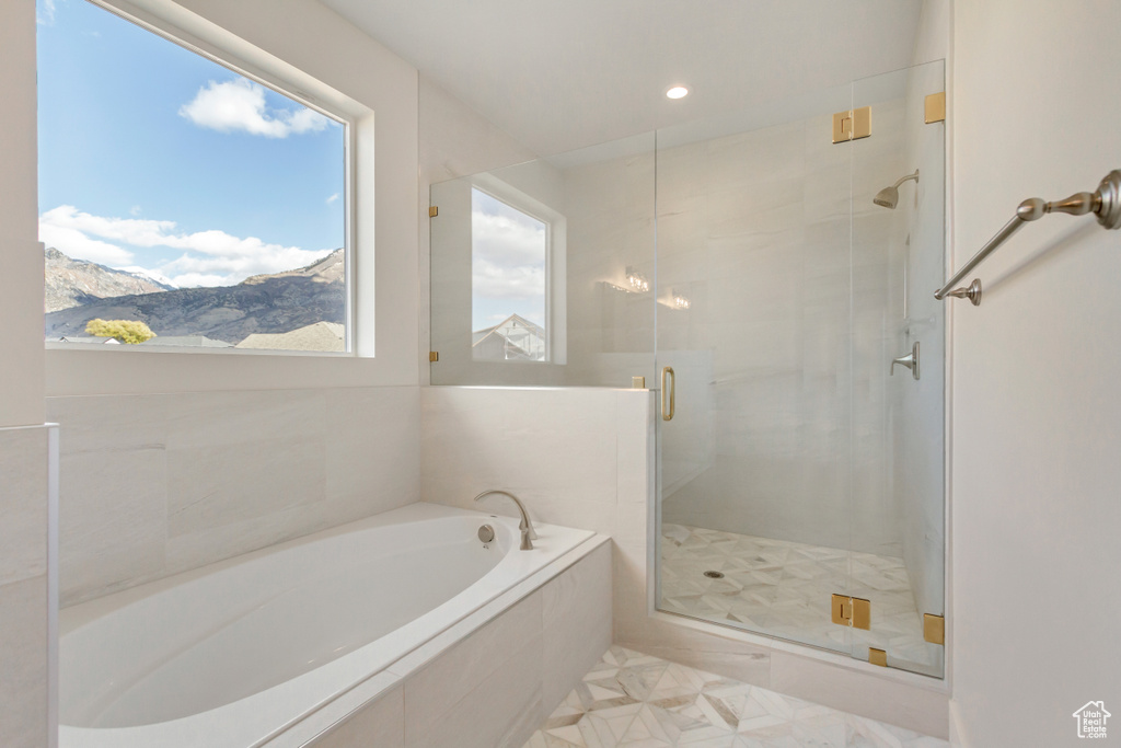 Bathroom with a mountain view, tile patterned flooring, and independent shower and bath