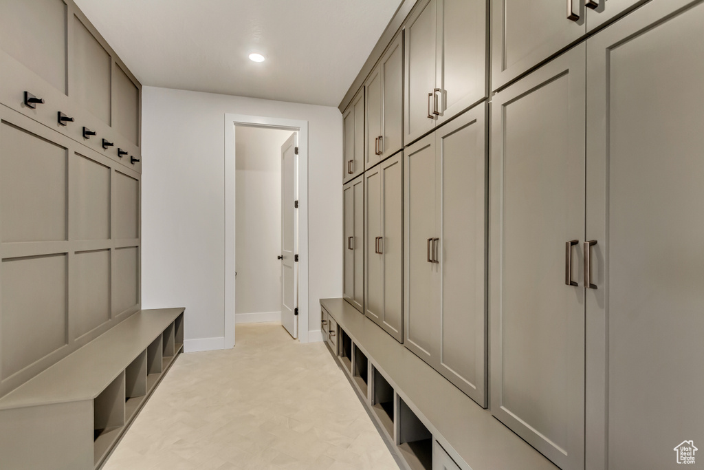 Mudroom featuring light carpet