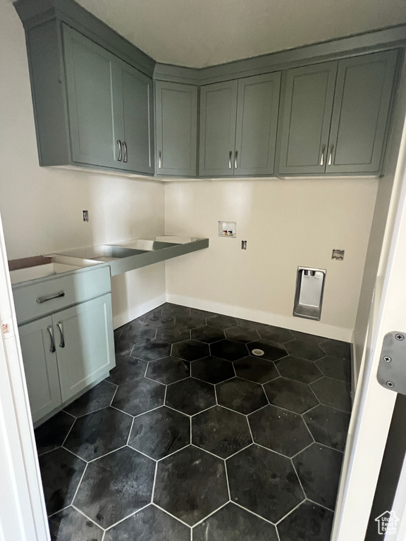 Clothes washing area with hookup for a washing machine and cabinets