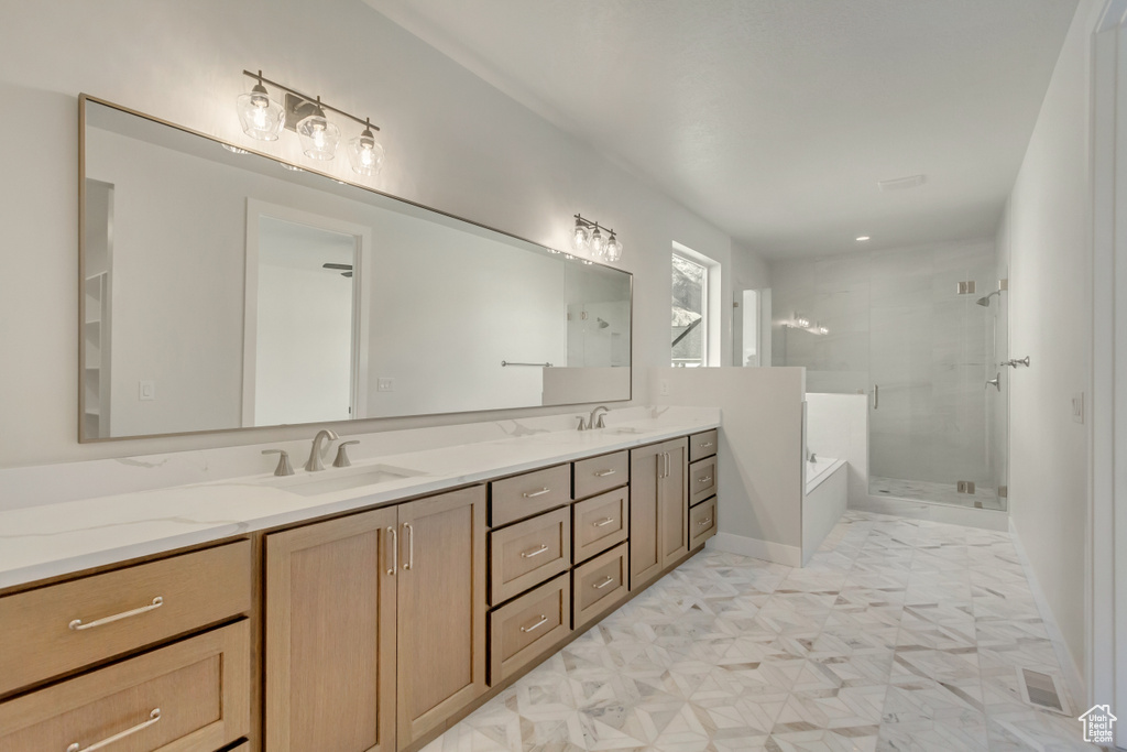 Bathroom with vanity and independent shower and bath